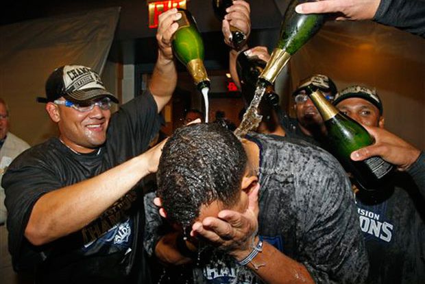 Melky Cabrera and other teammates douse Alex Rodriguez with champagne